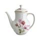 Vintage theepot met roze roosjes en twee fotomodellen uit de jaren '50